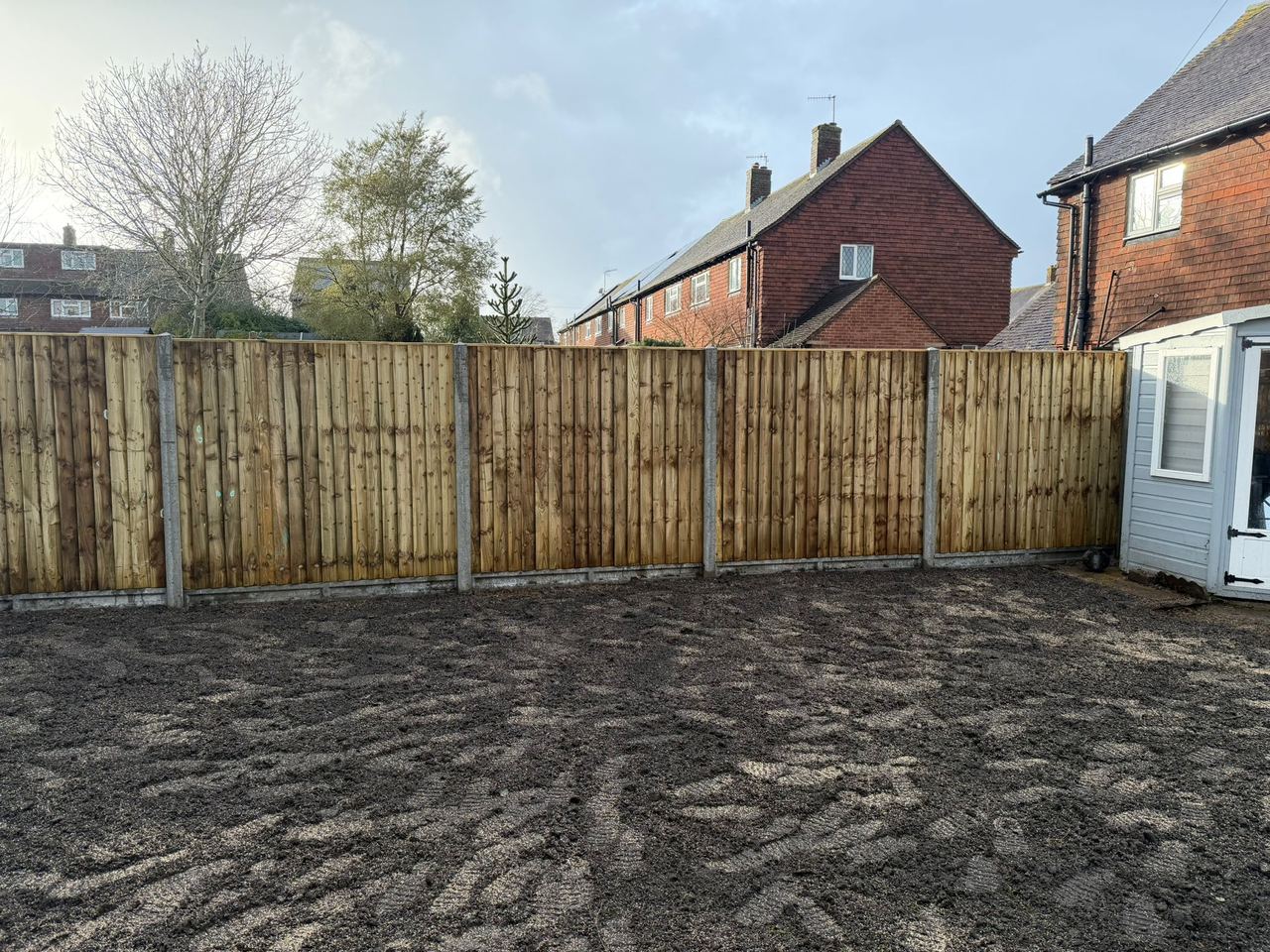 New feather-edge fence panels installed in rear garden